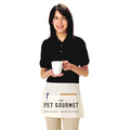 A person wearing a black shirt and a tan apron with 'The Pet Gourmet' text and a small graphic logo on the front.